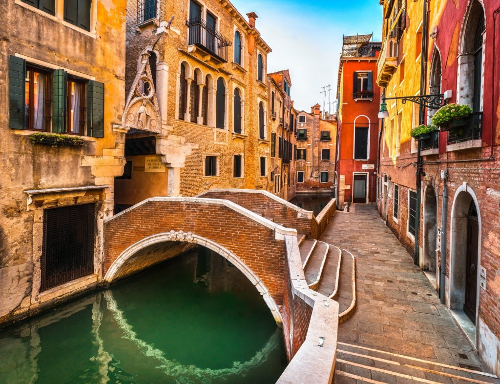 Venice cityscape, water canal, bridge and traditional buildings. Italy, Europe.