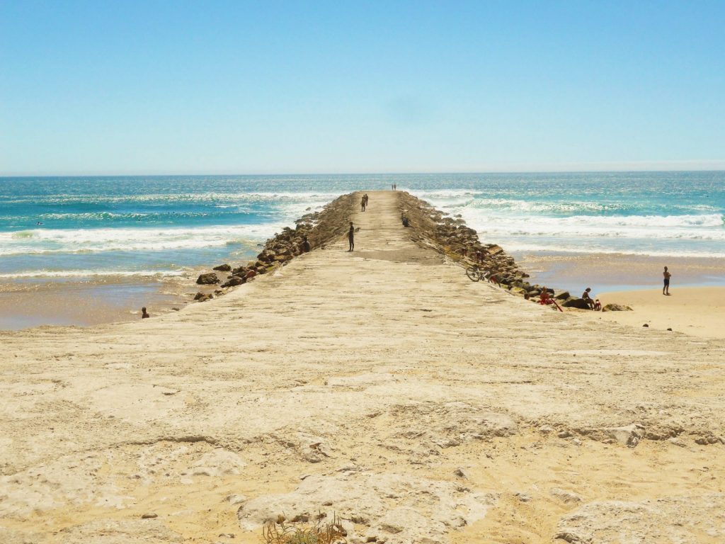 One of pretty piers along Costa da Caparica beaches in Portugal