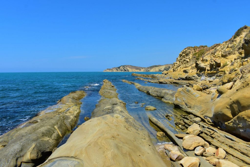 Albania - best places - Unusual stripes of limestone in a beach in Narta Lagoon
