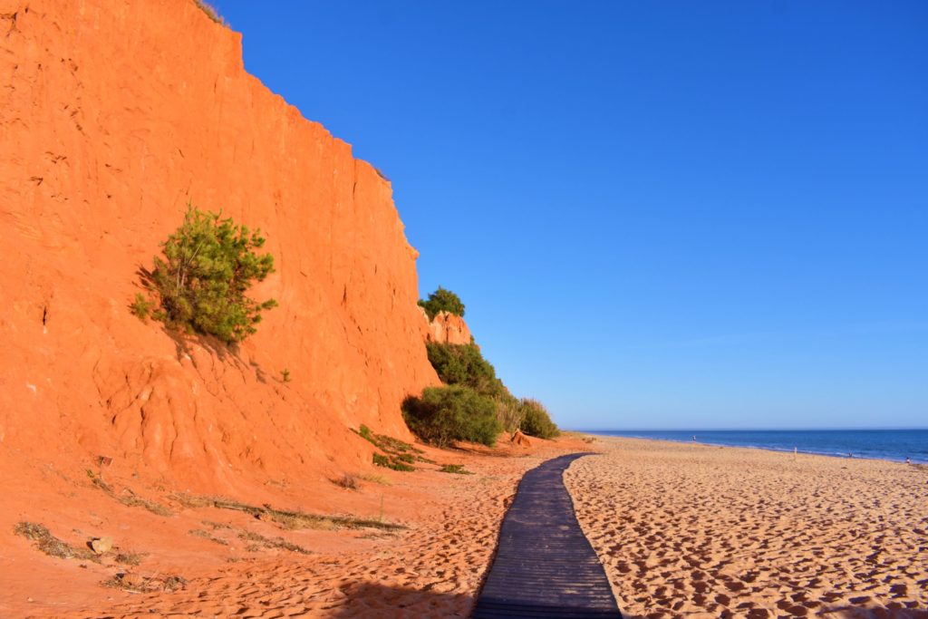 Praia de Vale do Lobo is flanked by stunning deep-orange cliffs - Algarve, Portugal