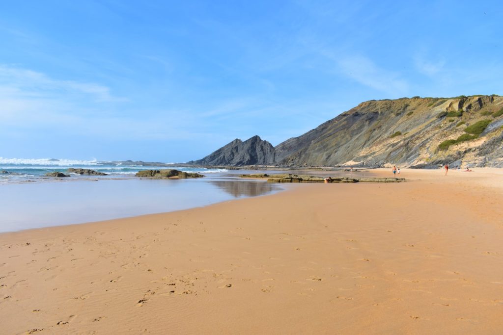 Vast Praia da Amoreira has a great variety of rocks' shapes and colours