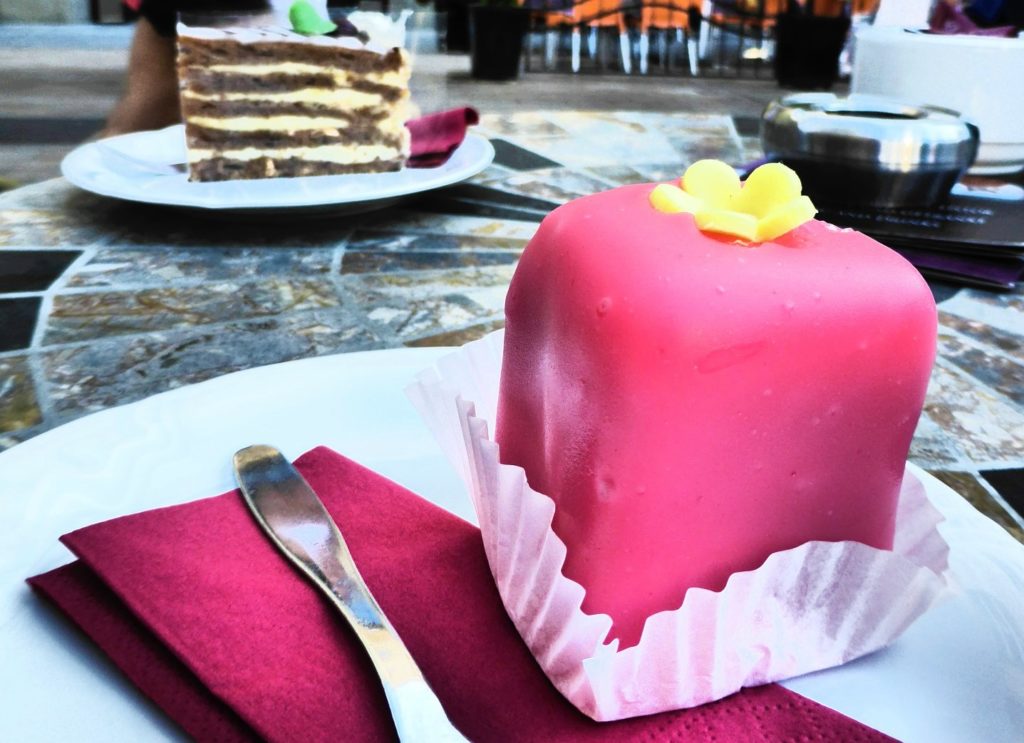 Attractively pink glazed Punschkrapfen are a classical Austrian dessert - Typical Austrian Food